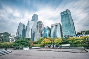Selbstklebende Fototapeten modern office buildings in seoul in cloud sky from © zhu difeng