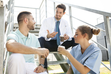 Healthcare workers taking a coffee break outdoors