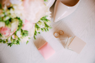 Fototapeta na wymiar Wedding accessories. Bouquet and accessories of bride. Wedding details
