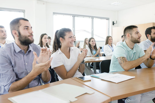 Healthcare workers in training class clapping
