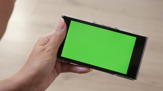 Green screen tablet display with female at home 4K 2160p 30fps UltraHD footage - Close-up of woman and greenscreen smart phone in hands 3840X2160 UHD video 