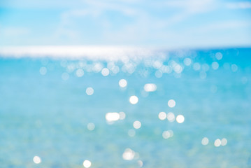 Shell on sand at beach and blue sky and bokeh sea.