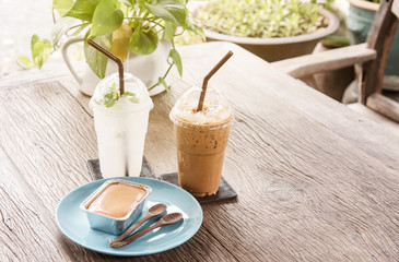 Coffee and bread at relaxation time on wooden table in morning.