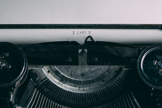 Close up of a retro typewriter with love message