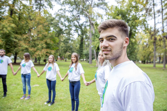 Teenage volunteers doing garbage cleanup in park