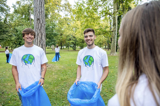 Teenage volunteers doing garbage cleanup in park