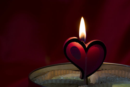 St Valentine's day greeting card with candle  form of heart. Love cookies.