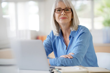 Senior businesswoman working in office