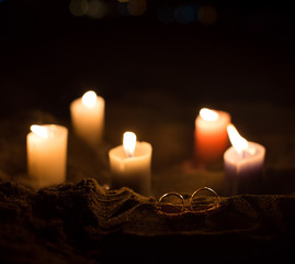 wedding rings and candles
