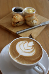 Coffee with Leaf Art with Scones and Jam