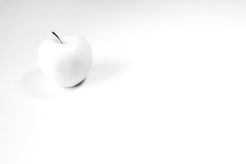 White apple on white background