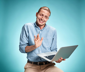 Sad Young Man Working On Laptop