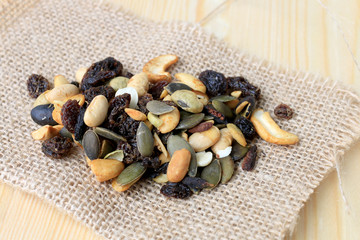 mixed nuts on wooden table.