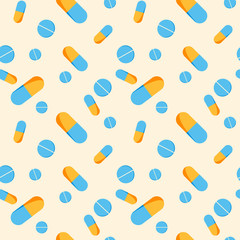 Seamless pattern with yellow and blue capsules and blue pills
