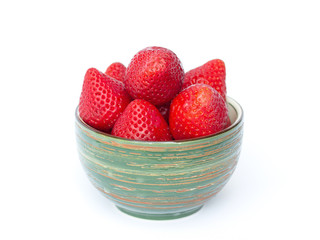 Fresh strawberries in a bowl on a white background