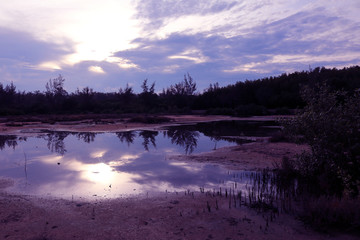 Obraz premium Mirror of purple sky in the morning reflection to the water ,Thailand. 