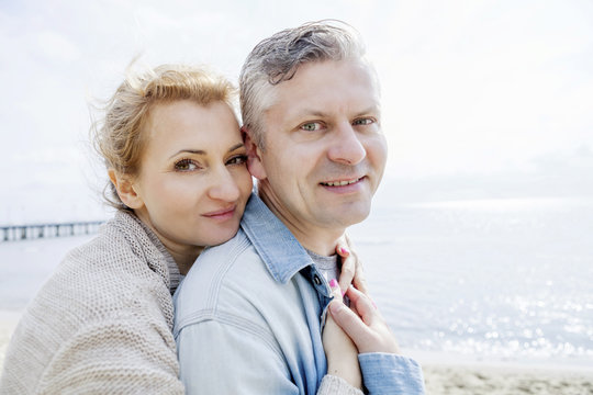Couple in love embracing on beach