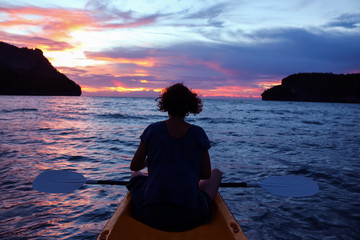 Women looking sunset on kayaking between the Islands at angthong National park. 