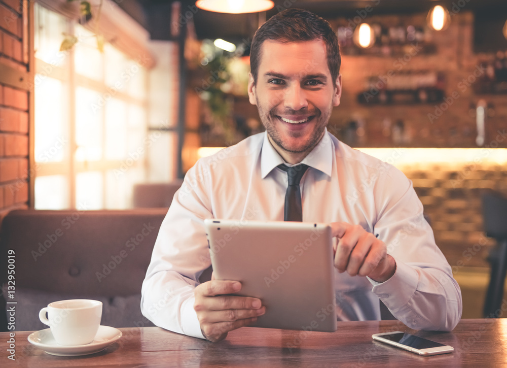 Wall mural attractive businessman in cafe