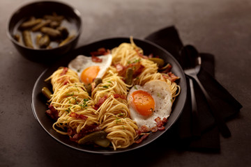 Scampi noodles with eggs and bacon for breakfast