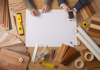 Businessman and construction engineer working at desk