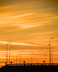 Fototapeta na wymiar Dramatic red sunset over highway