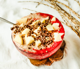 smoothie bowl with banana, apple and strawberry sauce,