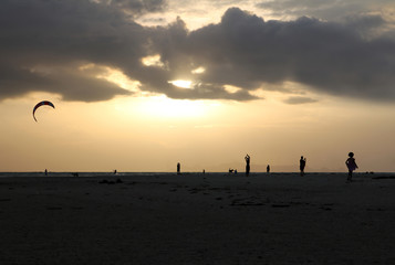 People with sunset on the beach.  