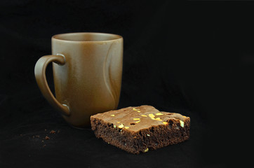 Closeup of coffee cup and brownies.
