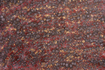 Carta Marmorizzata Fiorentina a macchie rosse, nere e dorate.