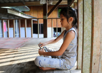 Asian girls in the local house in Thailand. 