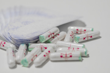 Different types of feminine hygiene products -  sanitary pads and tampons