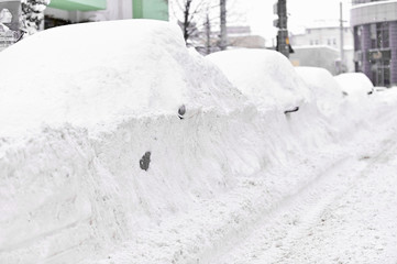 Full snow covered cars