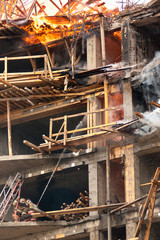 Firemen extinguish a house and building;
