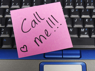 Memo note on notebook, call me