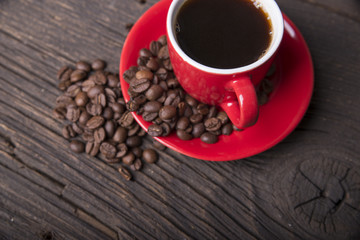 Cup of coffee with brown sugar on a wooden table