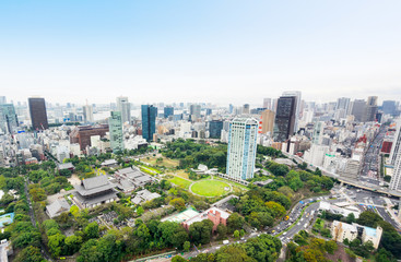 Obraz premium Business and culture concept - panoramic modern city skyline bird eye aerial view with zojo-ji temple shrine from tokyo tower under dramatic sunrise and morning blue sky in Tokyo, Japan