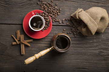Cup of coffee with brown sugar on a wooden table