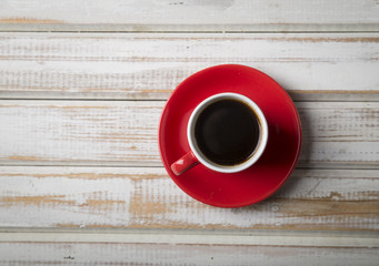 Cup of coffee with brown sugar on a wooden table