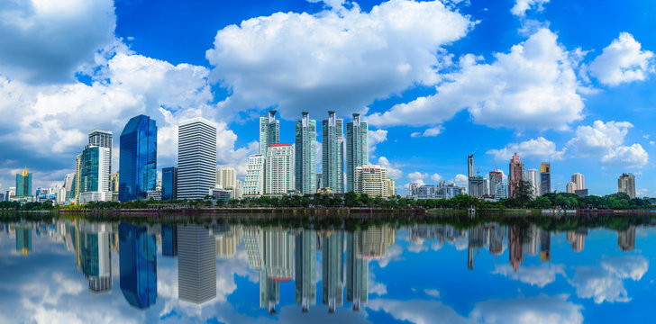 Cityscape image of Benchakitti Park at blue sky background in Bangkok, Thailand.