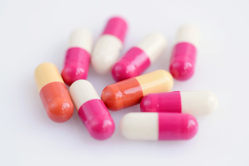 Close-up of medical capsule on white background