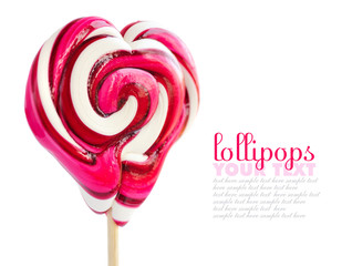 Colourful lollipop in the shape of a heart isolated on white background