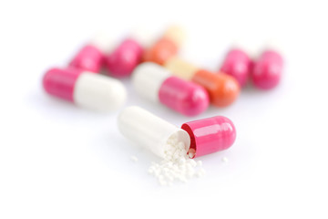 Close-up of medical capsule on white background