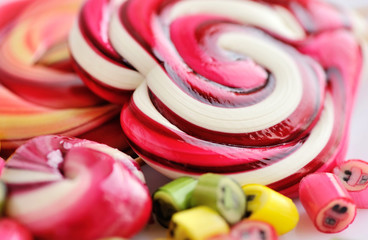 Colorful candies and lollipops on a white background