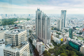 Fototapeta na wymiar Business and culture concept - panoramic modern city skyline bird eye aerial view under dramatic sun and morning blue cloudy sky in Tokyo, Japan