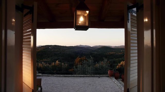 camera tracking through window of a villa revealing the view