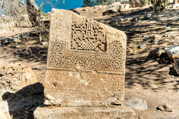 Van, Turkey - September 30, 2013:  Tombstone at the cemetery of The Cathedral of the Holy Cross (Akdamar Kilisesi)