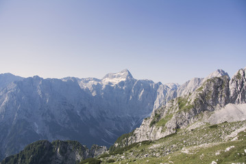 Fototapeta na wymiar Panorama of beautiful snowy mountains, Julian Alps, Europe. The highest mountain in Slovenia and the highest peak of the Julian Alps.