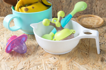 Set of accessories for the baby - pacifier, spoon and bowl