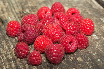 Raspberries on vintage wooden boards